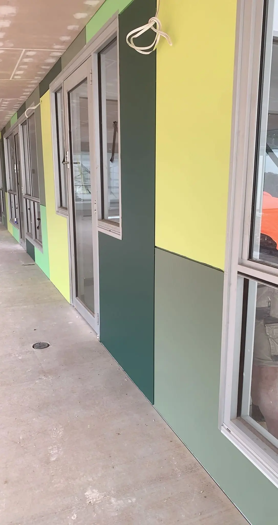 Commercial painting project completed for business office building with professional wall finish.