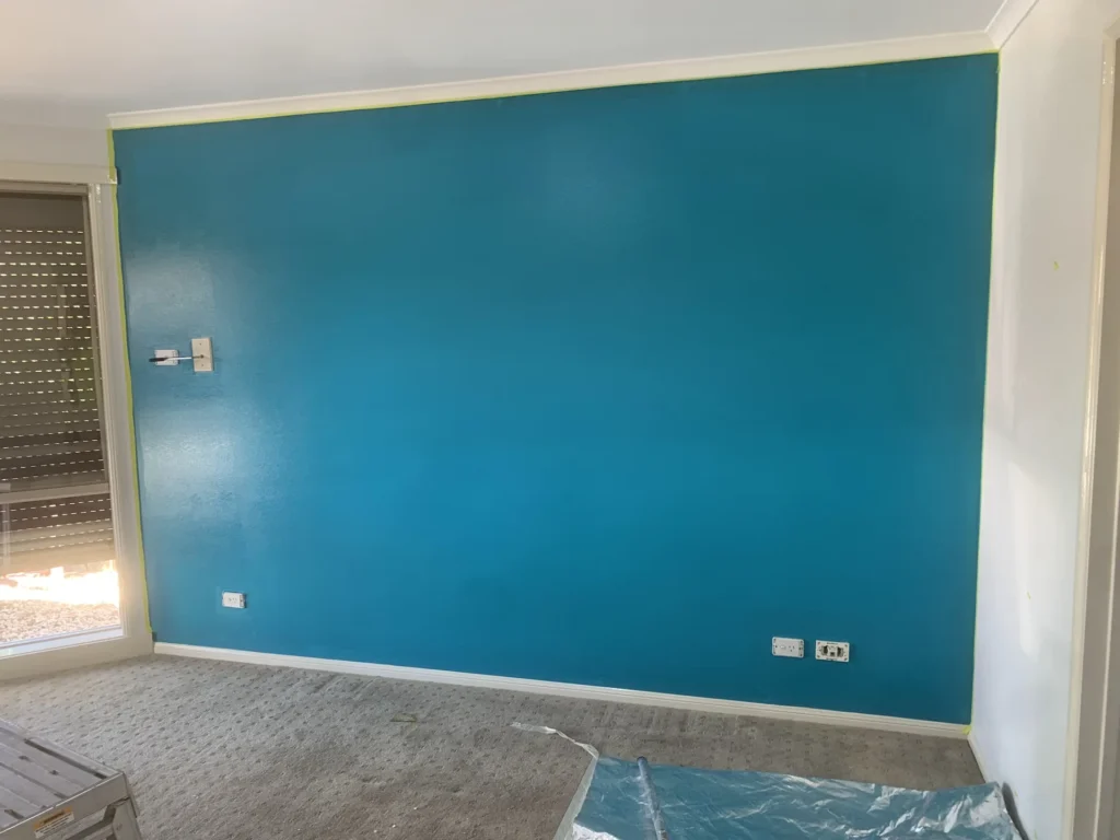 Teal feature wall in a living room – interior painting Melbourne by Ace Coating Services