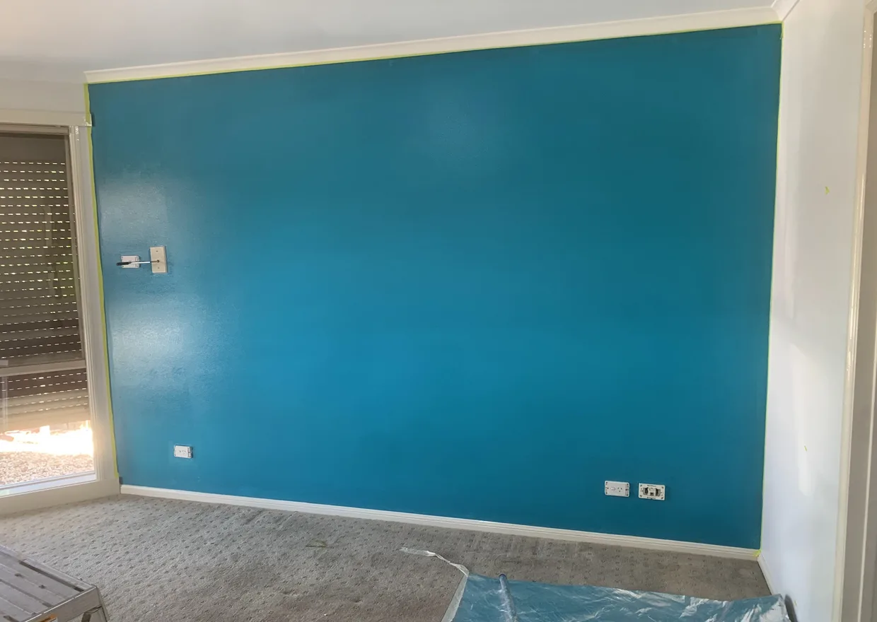 Teal feature wall freshly painted in a Melbourne home – residential painting by Ace Coating Services